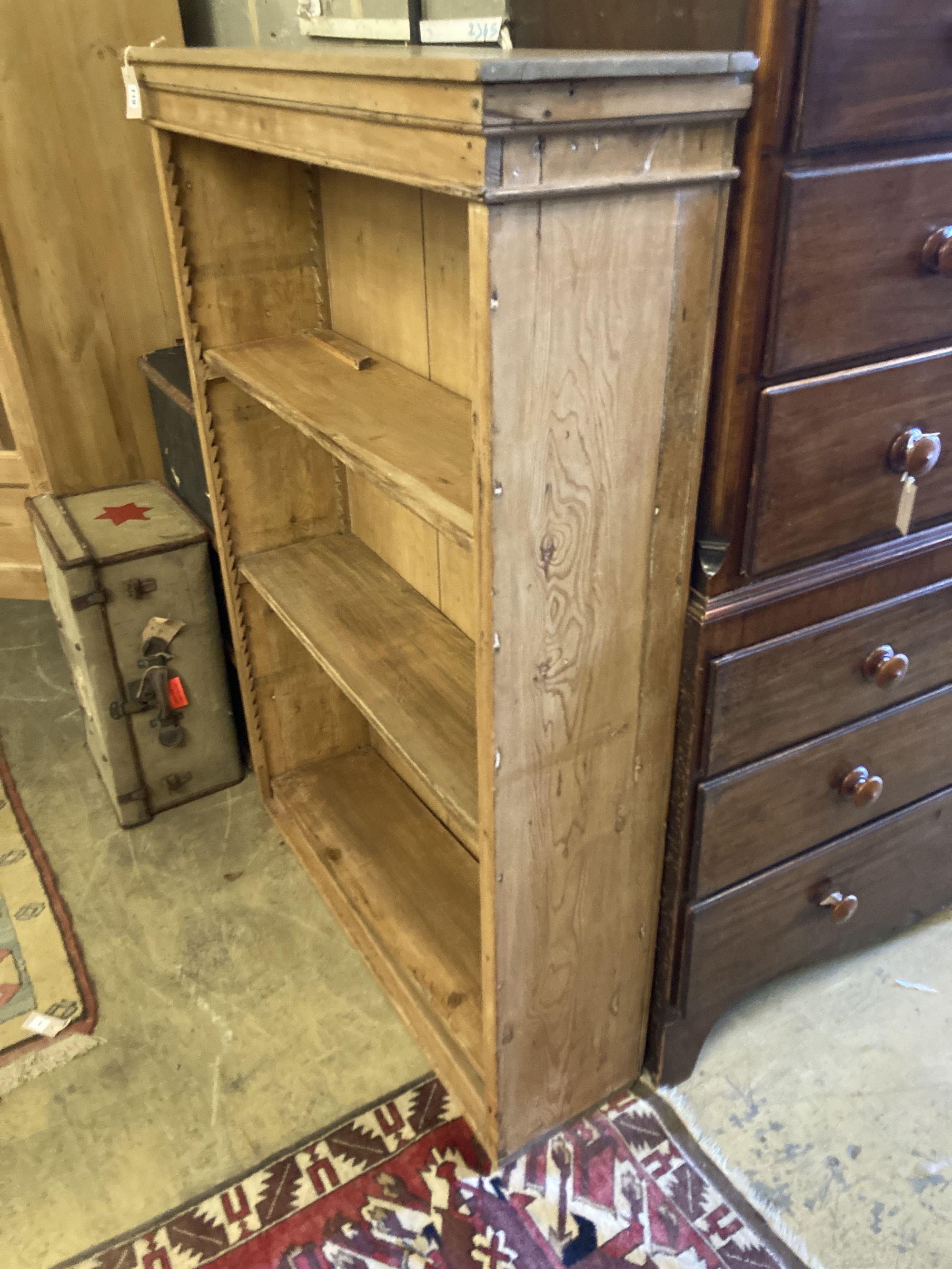 A Victorian pine open bookcase, width 108cm, depth 31cm, height 152cm